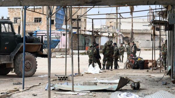 Сирийские военные в населенном пункте в провинции Алеппо