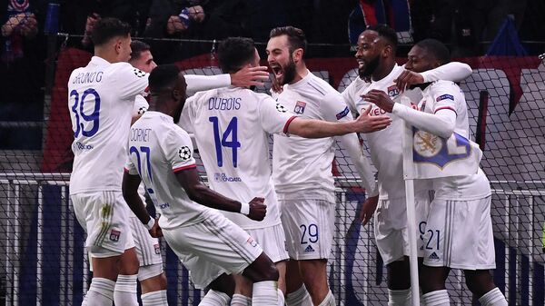 Lyon's French midfielder Lucas Tousart (C) celebrates with teammates after scoring a goal  during the UEFA Champions League round of 16 first-leg football match between Lyon and Juventus at the Parc Olympique Lyonnais stadium in Decines-Charpieu, central-eastern France, on February 26, 2020. (Photo by FRANCK FIFE / AFP)