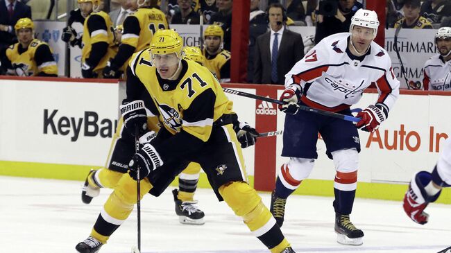 Mar 7, 2020; Pittsburgh, Pennsylvania, USA;  Pittsburgh Penguins center Evgeni Malkin (71) carries the puck against the Washington Capitals during the third period at PPG PAINTS Arena. Washington won 5-2. Mandatory Credit: Charles LeClaire-USA TODAY Sports