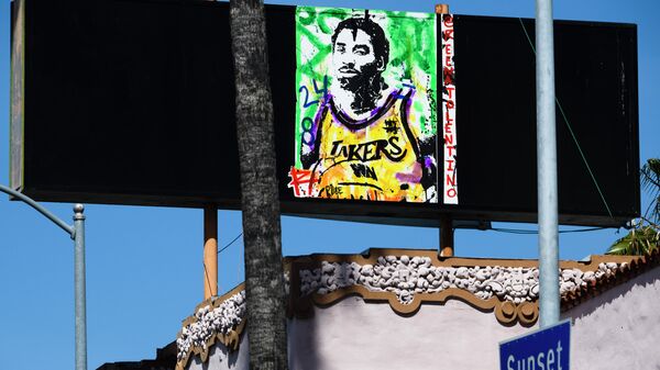 A painting of the late basketball icon Kobe Bryant by @reenatolentino is seen in Hollywood, California, April 23, 2020. - Three months after his death nearly 100 items of Bryant memorabilia, including NBA Finals game-worn sneakers, game jerseys and a championship ring are going on the auction block in a sale by goldinauctions.com ending on May 16, according to ESPN. (Photo by Robyn Beck / AFP) / RESTRICTED TO EDITORIAL USE - MANDATORY MENTION OF THE ARTIST @reenatalentino UPON PUBLICATION - TO ILLUSTRATE THE EVENT AS SPECIFIED IN THE CAPTION