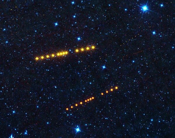 Серия фотографий астероидов Клото и Лина, снятые телескопом NEOWISE