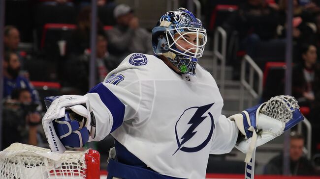 DETROIT, MICHIGAN - DECEMBER 04: Edward Pasquale #80 of the Tampa Bay Lightning looks on while playing the Detroit Red Wings at Little Caesars Arena on December 04, 2018 in Detroit, Michigan. Tampa Bay won the game 6-5 in a shootout.   Gregory Shamus/Getty Images/AFP