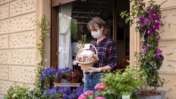 Продавец цветов на одной из улиц в Турине