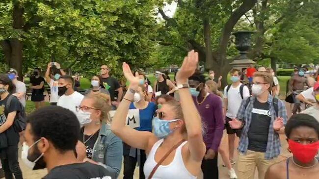 Акция протеста в Вашингтоне против насилия со стороны полицейских 