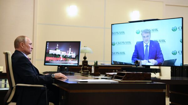 Президент РФ Владимир Путин во время встречи в режиме видеоконференции с президентом, председателем правления Сбербанка РФ Германом Грефом