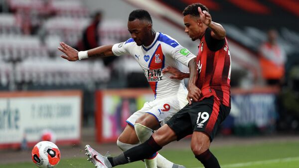 Crystal Palace's French-born Ghanaian striker Jordan Ayew (L) is challenged by Bournemouth's English midfielder Junior Stanislas during the English Premier League football match between Bournemouth and Crystal Palace at the Vitality Stadium in Bournemouth, southern England on June 20, 2020. (Photo by Ian Walton / POOL / AFP) / RESTRICTED TO EDITORIAL USE. No use with unauthorized audio, video, data, fixture lists, club/league logos or 'live' services. Online in-match use limited to 120 images. An additional 40 images may be used in extra time. No video emulation. Social media in-match use limited to 120 images. An additional 40 images may be used in extra time. No use in betting publications, games or single club/league/player publications. / 