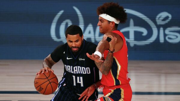 LAKE BUENA VISTA, FLORIDA - AUGUST 13: D.J. Augustin #14 of the Orlando Magic drives against Frank Jackson #15 of the New Orleans Pelicans during the second half of an NBA basketball game at the ESPN Wide World Of Sports Complex on August 13, 2020 in Lake Buena Vista, Florida. NOTE TO USER: User expressly acknowledges and agrees that, by downloading and or using this photograph, User is consenting to the terms and conditions of the Getty Images License Agreement.   Kim Klement-Pool/Getty Images/AFP