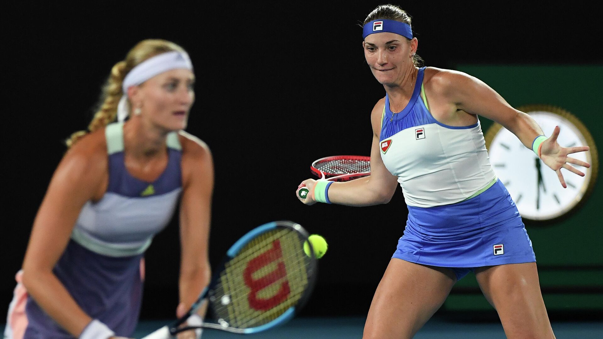 Hungary's Timea Babos (R) and France's Kristina Mladenovic (L) play a point against Taiwan's Hsieh Su-wei and Czech Republic's Barbora Strycova during the women's doubles final on day twelve of the Australian Open tennis tournament in Melbourne on January 31, 2020. (Photo by Greg Wood / AFP) / IMAGE RESTRICTED TO EDITORIAL USE - STRICTLY NO COMMERCIAL USE - РИА Новости, 1920, 05.09.2020
