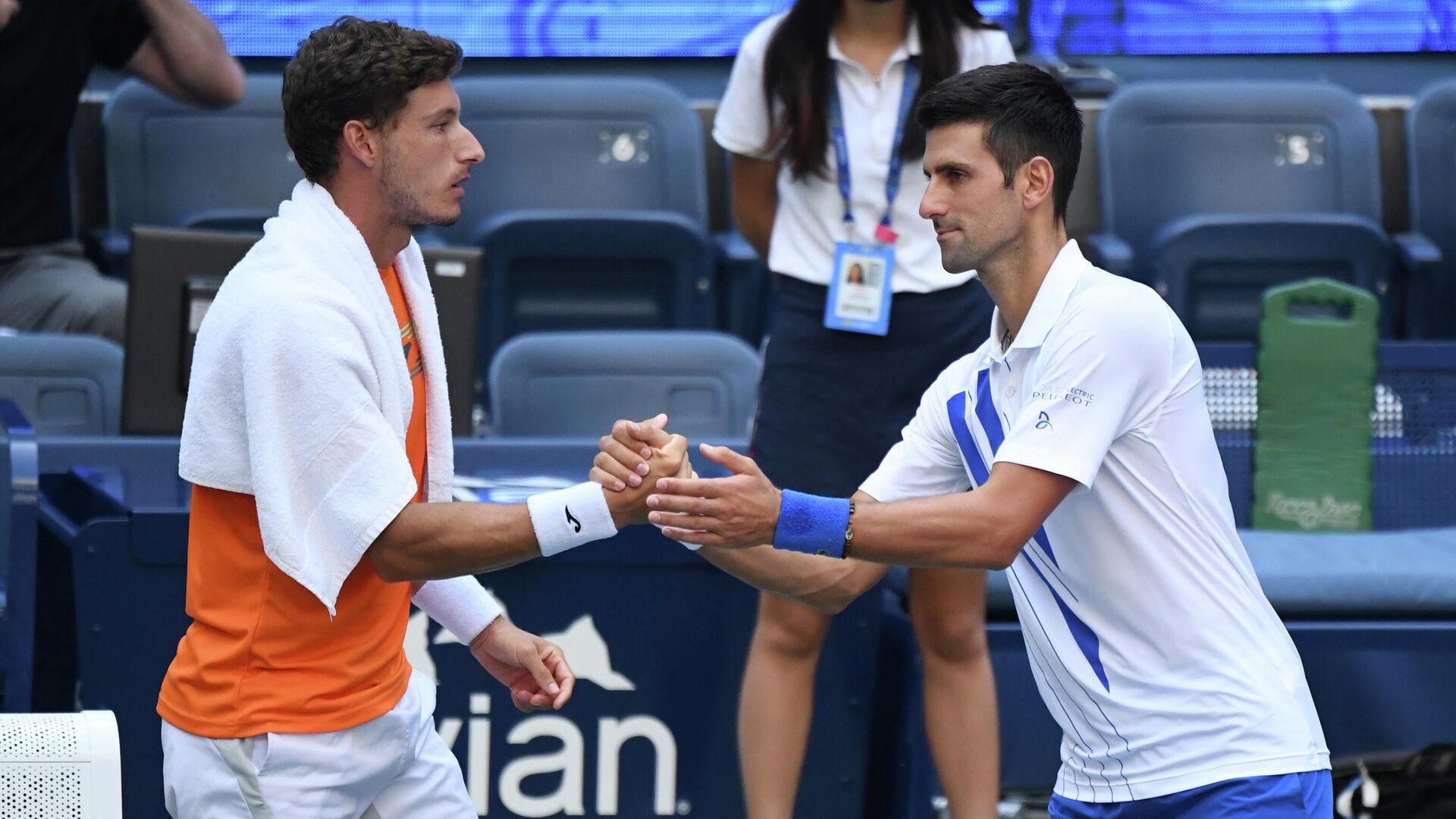 Sep 6, 2020; Flushing Meadows, New York, USA; Novak Djokovic of Serbia shakes hands with Pablo Carreno Busta of Spain after being defaulted for striking a lines person with a ball on day seven of the 2020 U.S. Open tennis tournament at USTA Billie Jean King National Tennis Center. Mandatory Credit: Danielle Parhizkaran-USA TODAY Sports - РИА Новости, 1920, 07.09.2020