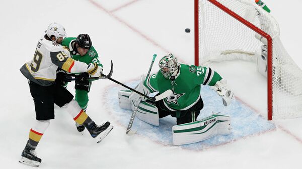 September 12, 2020; Edmonton, Alberta, CAN; Vegas Golden Knights right wing Alex Tuch (89) shoots against the defense of Dallas Stars defenseman Esa Lindell (23) as goaltender Anton Khudobin (35) defends the goal during the first period in game four of the Western Conference Final of the 2020 Stanley Cup Playoffs at Rogers Place. Mandatory Credit: Perry Nelson-USA TODAY Sports