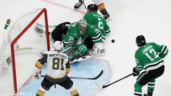 September 12, 2020; Edmonton, Alberta, CAN; Dallas Stars goaltender Anton Khudobin (35) defends the goal as center Mattias Janmark (13) provides coverage against Vegas Golden Knights center Jonathan Marchessault (81) during the second period in game four of the Western Conference Final of the 2020 Stanley Cup Playoffs at Rogers Place. Mandatory Credit: Perry Nelson-USA TODAY Sports