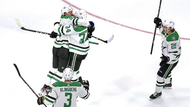 EDMONTON, ALBERTA - SEPTEMBER 14: Denis Gurianov #34 of the Dallas Stars is congratulated by his teammates after scoring the game-winning goal against the Vegas Golden Knights during the first overtime period to win Game Five of the Western Conference Final during the 2020 NHL Stanley Cup Playoffs at Rogers Place on September 14, 2020 in Edmonton, Alberta, Canada.   Bruce Bennett/Getty Images/AFP