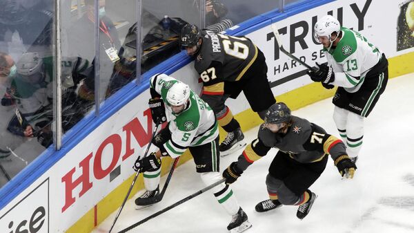 Sep 14, 2020; Edmonton, Alberta, CAN; Vegas Golden Knights center William Karlsson (71) reaches for the puck on Dallas Stars defenseman Andrej Sekera (5) during the second period in game five of the second round of the 2020 Stanley Cup Playoffs at Rogers Place. Mandatory Credit: Gerry Thomas-USA TODAY Sports