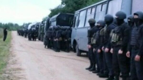 Сосредоточенные у белорусской границы российские силовики возвращаются в места постоянной дислокации. Кадр видео