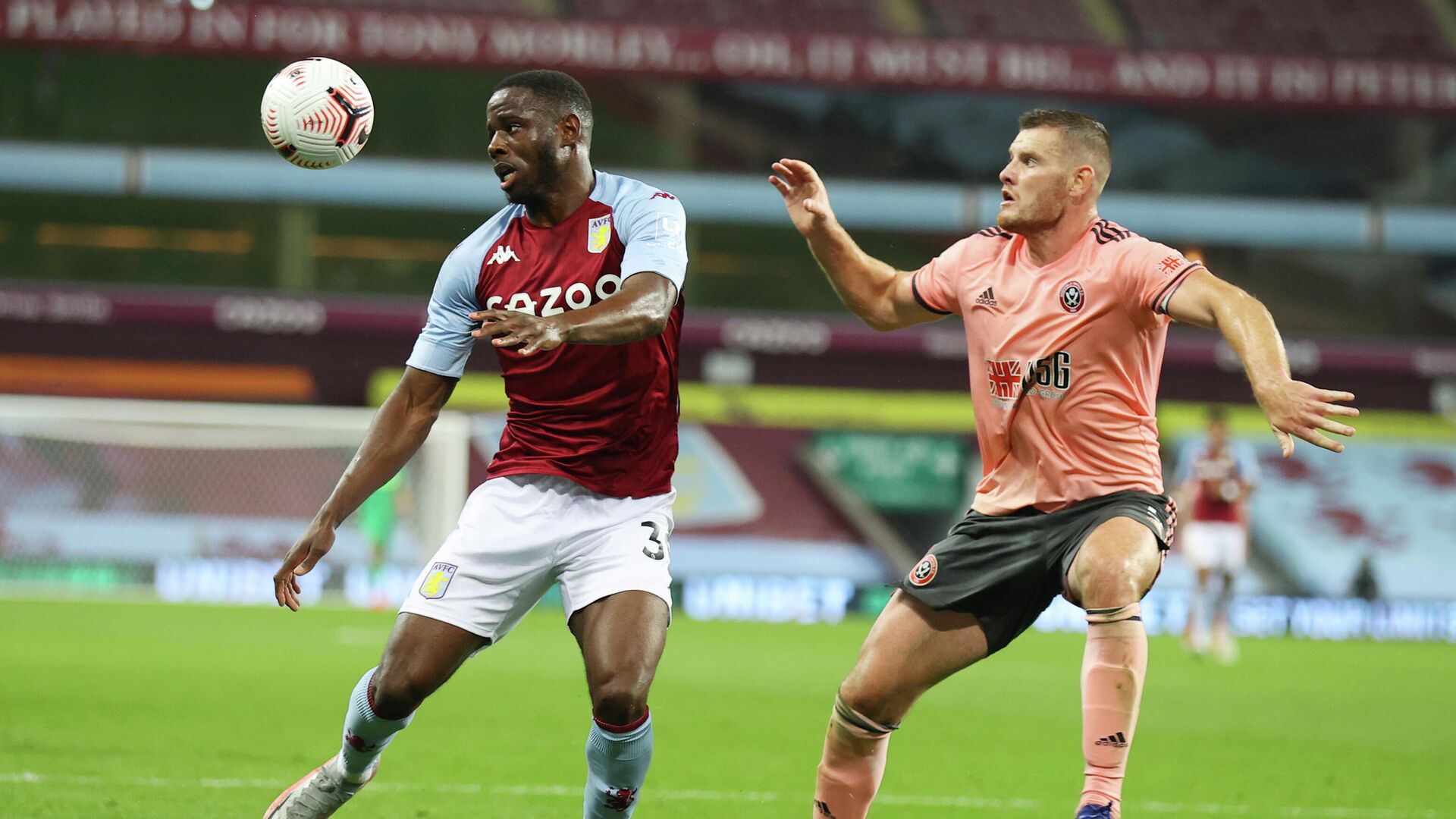 Soccer Football - Premier League - Aston Villa v Sheffield United - Villa Park, Birmingham, Britain - September 21, 2020 Aston Villa's Keinan Davis in action with Sheffield United's Jack O'Connell Pool via REUTERS/Julian Finney EDITORIAL USE ONLY. No use with unauthorized audio, video, data, fixture lists, club/league logos or 'live' services. Online in-match use limited to 75 images, no video emulation. No use in betting, games or single club/league/player publications.  Please contact your account representative for further details. - РИА Новости, 1920, 22.09.2020