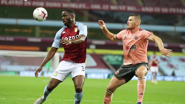 Soccer Football - Premier League - Aston Villa v Sheffield United - Villa Park, Birmingham, Britain - September 21, 2020 Aston Villa's Keinan Davis in action with Sheffield United's Jack O'Connell Pool via REUTERS/Julian Finney EDITORIAL USE ONLY. No use with unauthorized audio, video, data, fixture lists, club/league logos or 'live' services. Online in-match use limited to 75 images, no video emulation. No use in betting, games or single club/league/player publications.  Please contact your account representative for further details.