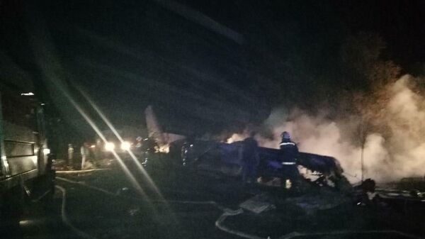 На месте крушения военно-транспортного самолета Ан-26 ВВС Украины под Харьковом