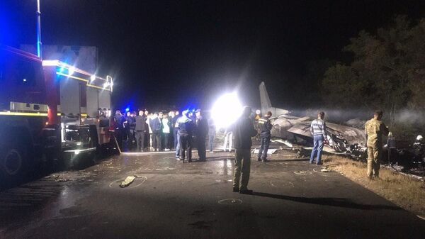 На месте крушения военно-транспортного самолета Ан-26 ВВС Украины под Харьковом