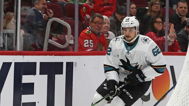 CHICAGO, ILLINOIS - MARCH 11: Kevin Labanc #62 of the San Jose Sharks skates with the puck behind the Sharks net against the Chicago Blackhawks at the United Center on March 11, 2020 in Chicago, Illinois. The Blackhawks defeated the Sharks 6-2.   Jonathan Daniel/Getty Images/AFP