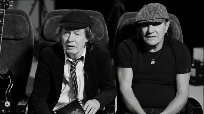 Музыканты группы AC/DC Ангус Янг и Брайан Джонсон