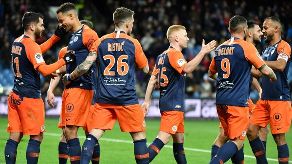 Montpellier's players react after scoring a goal during the French L1 football match between Montpellier and Strasbourg at the Mosson stadium in Montpellier, southern France, on February 29, 2020. (Photo by Pascal GUYOT / AFP)