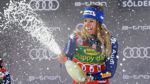 Alpine Skiing - FIS Ski World Cup - Soelden - Women's Giant Slalom - Soelden, Austria - October 17, 2020 Italy's Marta Bassino celebrates on the podium with sparkling wine after winning the event REUTERS/Leonhard Foeger