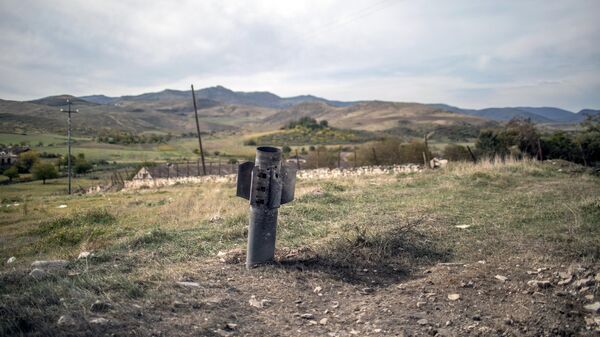 Неразорвавшийся снаряд после обстрела города Мартуни в Нагорном Карабахе