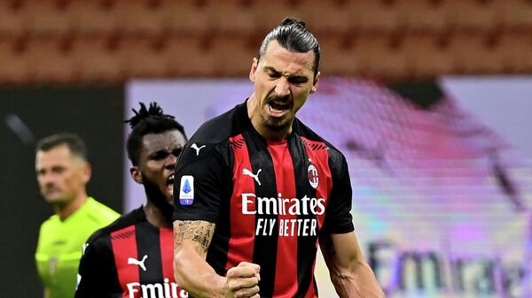 AC Milan's Swedish forward Zlatan Ibrahimovic celebrates after scoring a penalty against AS Roma during the Italian Serie A football match between AC Milan and AS Roma at the Meazza Stadium in Milan on October 26, 2020. (Photo by MIGUEL MEDINA / AFP)