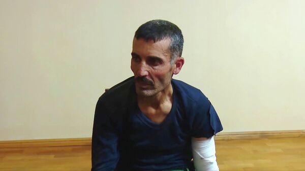Взятый в плен сириец, который участвовал в боевых действиях на стороне Азербайджана. Стоп-кадр видео