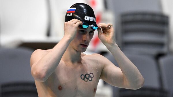 Григорий Тарасевич после финального заплыва среди мужчин на дистанции 50 метров на спине на чемпионате России по плаванию в Казани.