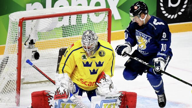 Ice Hockey - Karjala Cup - Finland v Sweden - Hartwall Arena, Helsinki, Finland - November 8, 2020   Finland's Eemeli Suomi in action with Sweden's Niklas Rubin Vesa Moilanen/Lehtikuva via REUTERS  ATTENTION EDITORS - THIS IMAGE WAS PROVIDED BY A THIRD PARTY. NO THIRD PARTY SALES. NOT FOR USE BY REUTERS THIRD PARTY DISTRIBUTORS. FINLAND OUT. NO COMMERCIAL OR EDITORIAL SALES IN FINLAND.