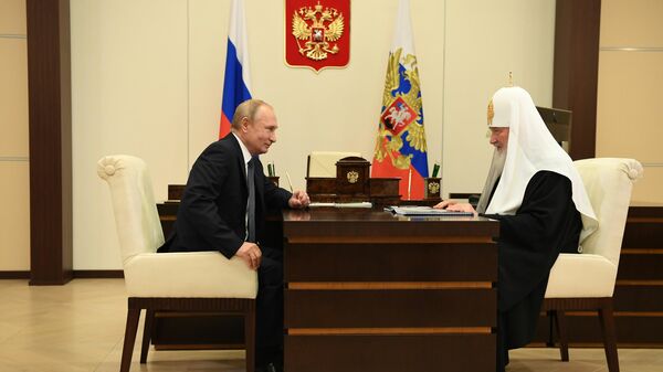 Президент России Владимир Путин и патриарх Кирилл во время встречи