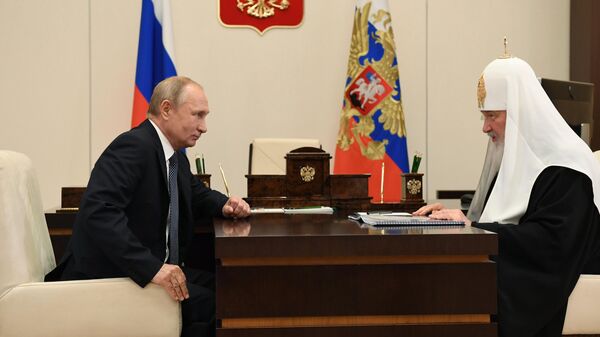 Президент РФ Владимир Путин и патриарх Московский и всея Руси Кирилл во время встречи.