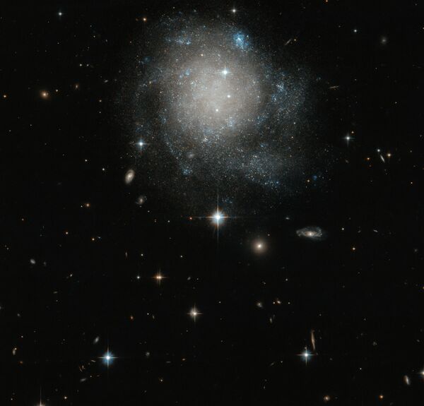 Спиральная галактика UGC 12588 в созвездии Андромеды