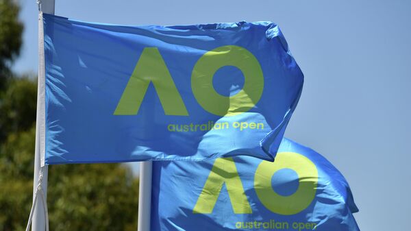 Australian Open flags flutter in the wind on day five of the Australian Open tennis tournament in Melbourne on January 19, 2018. (Photo by Paul Crock / AFP) / -- IMAGE RESTRICTED TO EDITORIAL USE - STRICTLY NO COMMERCIAL USE --