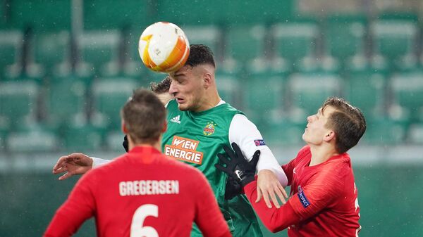 Rapid Wien's Austrian forward Ercan Kara and Molde's Norwegian defender Marcus Holmgren Pedersen vie for the ball during the UEFA Europa League Group B football match between SK Rapid Wien and Molde FK at the Weststadion in Vienna on December 10, 2020. (Photo by GEORG HOCHMUTH / APA / AFP) / AUSTRIA OUT