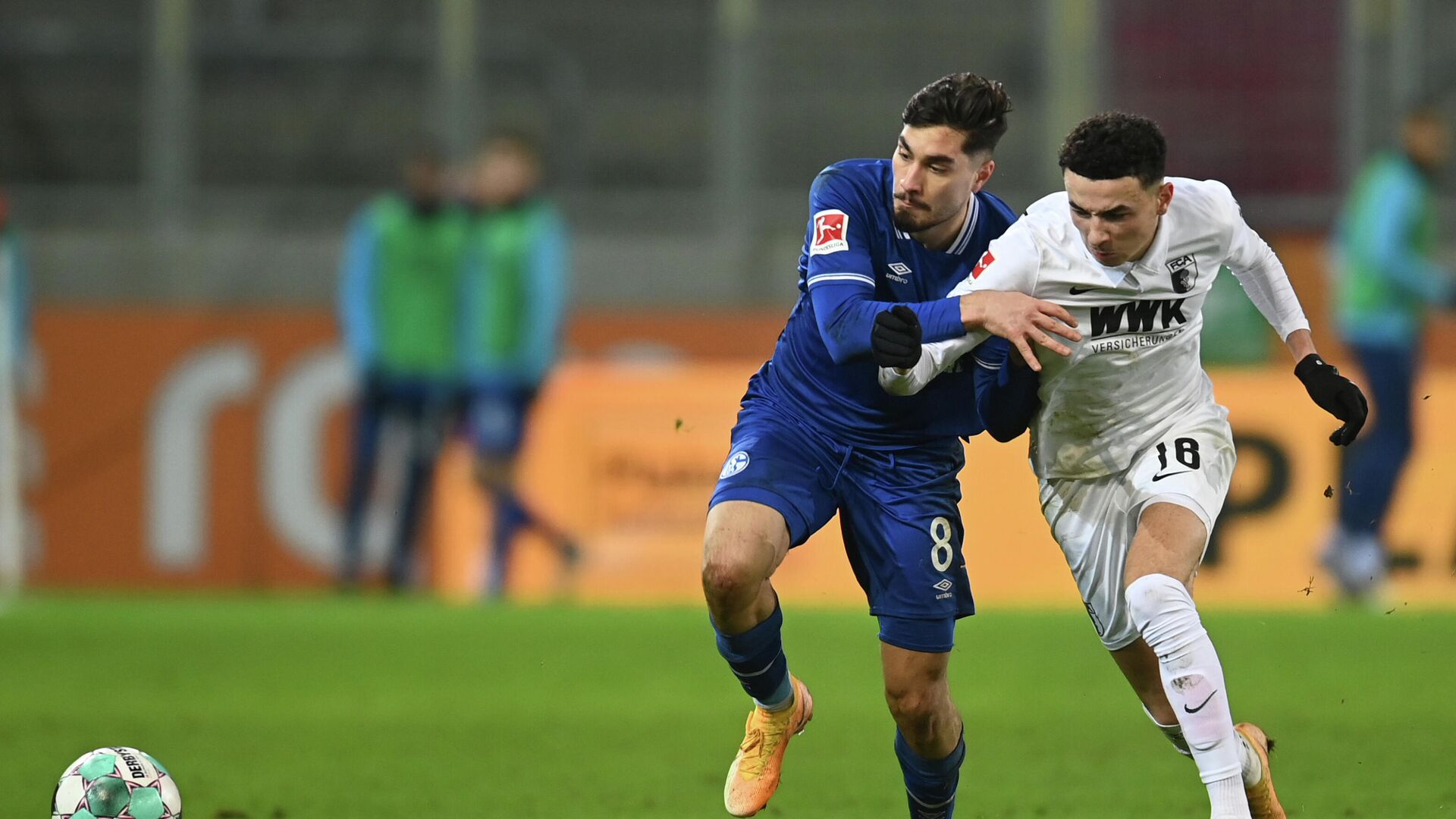 Augsburg's Swiss midfielder Ruben Vargas (R) and Schalke's German midfielder Suat Serdar vie for the ball during the German first division football Bundesliga match FC Augsburg 1907 vs FC Schalke 04 in Augsburg, southern Germany, on December 13, 2020. (Photo by Christof STACHE / various sources / AFP) / DFL REGULATIONS PROHIBIT ANY USE OF PHOTOGRAPHS AS IMAGE SEQUENCES AND/OR QUASI-VIDEO - РИА Новости, 1920, 13.12.2020