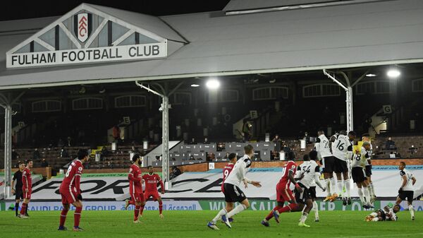 Fulham defenders handle the ball in the wall giving Liverpool a penalty during the English Premier League football match between Fulham and Liverpool at Craven Cottage in London on December 13, 2020. (Photo by Mike Hewitt / POOL / AFP) / RESTRICTED TO EDITORIAL USE. No use with unauthorized audio, video, data, fixture lists, club/league logos or 'live' services. Online in-match use limited to 120 images. An additional 40 images may be used in extra time. No video emulation. Social media in-match use limited to 120 images. An additional 40 images may be used in extra time. No use in betting publications, games or single club/league/player publications. / 