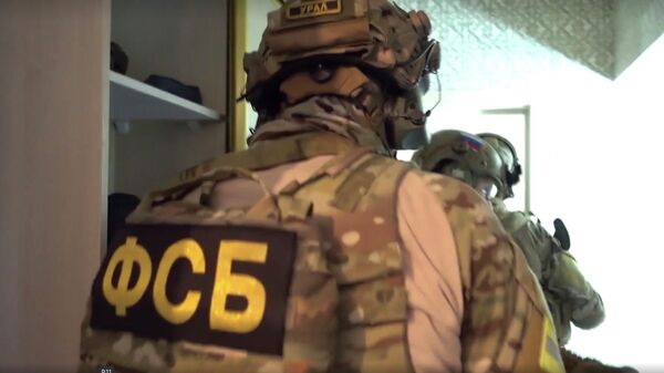 Сотрудники ФСБ во время спецоперации в Дагестане. Стоп-кадр видео