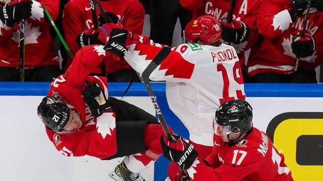 EDMONTON, AB - JANUARY 04: Kaiden Guhle #21 of Canada skates against Vasili Podkolzin #19 of Russia during the 2021 IIHF World Junior Championship semifinals at Rogers Place on January 4, 2021 in Edmonton, Canada.   Codie McLachlan/Getty Images/AFP