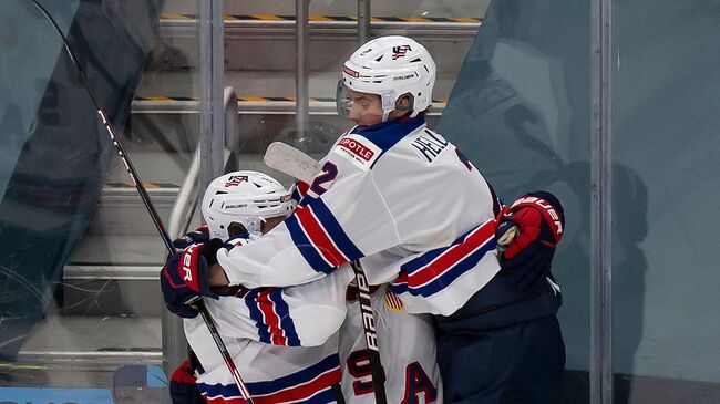 EDMONTON, AB - JANUARY 05: Trevor Zegras #9, Alex Turcotte #15 and Drew Helleson #2 of the United States celebrate a goal against Canada during the 2021 IIHF World Junior Championship gold medal game at Rogers Place on January 5, 2021 in Edmonton, Canada.   Codie McLachlan/Getty Images/AFP