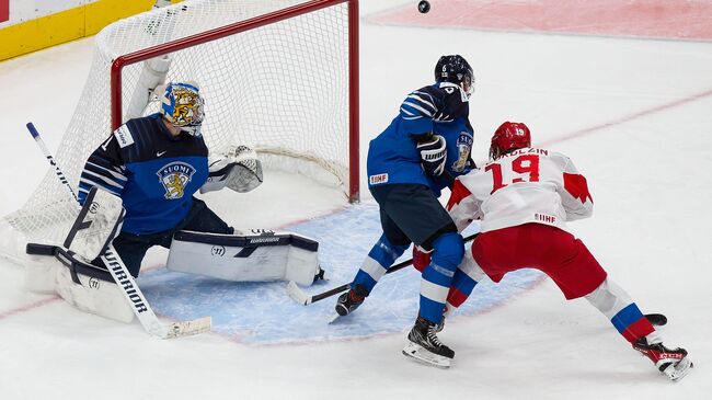 EDMONTON, AB - JANUARY 05: Vasili Podkolzin #19 of Russia skates against goaltender Kari Piiroinen #1 and Eemil Viro #6 of Finland during the 2021 IIHF World Junior Championship bronze medal game at Rogers Place on January 5, 2021 in Edmonton, Canada.   Codie McLachlan/Getty Images/AFP