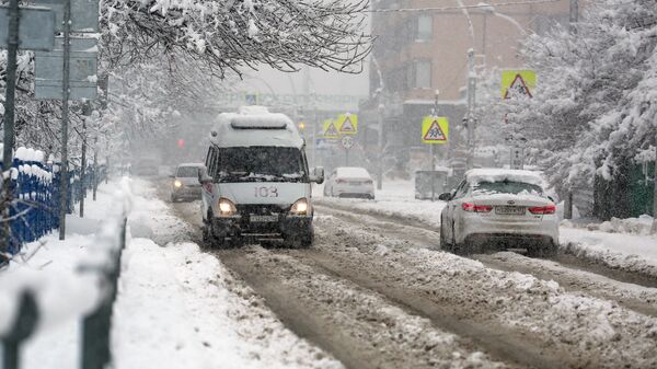 Автомобили во время снегопада