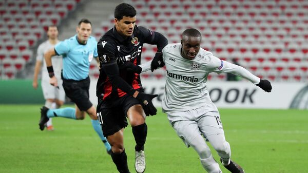 Nice's Brazilian midfielder Danilo (L) fights for the ball with Bayer Leverkusen's French forward Moussa Diaby during the UEFA Europa League group C football match between Nice and Bayer Leverkusen at The Allianz Riviera Stadium in Nice, southeastern France, on December 3, 2020. (Photo by Valery HACHE / AFP)