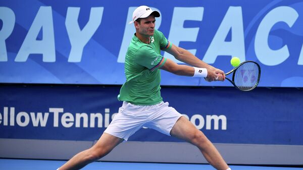 DELRAY BEACH, FLORIDA - JANUARY 11: Hubert Hurkacz of Poland plays a backhand against Roberto Quiroz of Ecuador (not pictured) during the Quarterfinals of the Delray Beach Open by Vitacost.com at Delray Beach Tennis Center on January 11, 2021 in Delray Beach, Florida.   Mark Brown/Getty Images/AFP