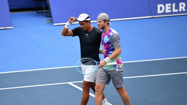 DELRAY BEACH, FLORIDA - JANUARY 12: Gonzalo Escobar of Ecuador and Ariel Behar of Uruguay celebrate after winning against Mackenzie McDonlad and Tommy Paul in the Doubles Semifinals of the Delray Beach Open by Vitacost.com at Delray Beach Tennis Center on January 12, 2021 in Delray Beach, Florida.   Mark Brown/Getty Images/AFP