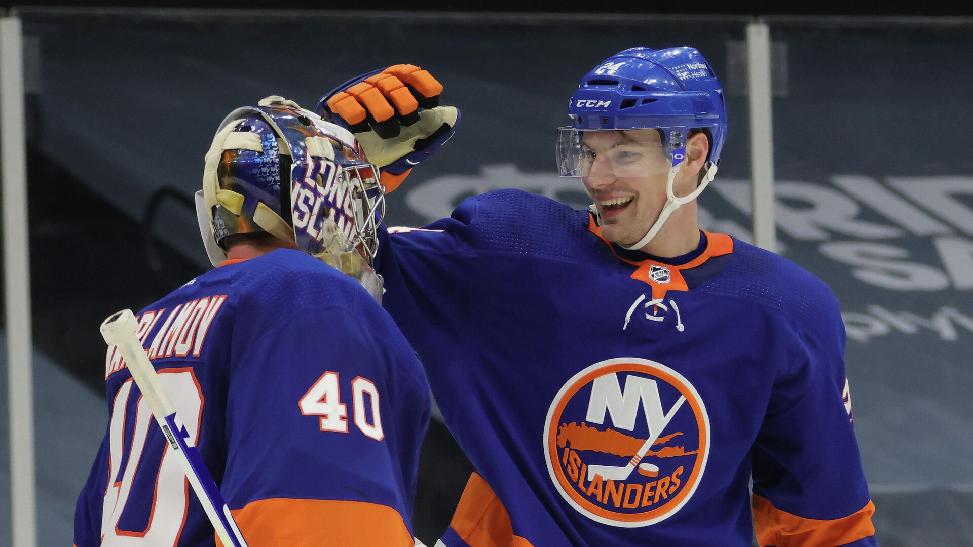 UNIONDALE, NEW YORK - JANUARY 18: Semyon Varlamov #40 and Scott Mayfield #24 of the New York Islanders celebrate a 1-0 shutout against the Boston Bruins at the Nassau Coliseum on January 18, 2021 in Uniondale, New York.   Bruce Bennett/Getty Images/AFP - РИА Новости, 1920, 19.01.2021