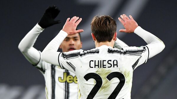 Juventus' Italian forward Federico Chiesa celebrates after scoring a goal during the Italian Cup quarter final football match beetween Juventus and Spal on January 27, 2021 at the Allianz stadium in Turin. (Photo by Isabella BONOTTO / AFP)