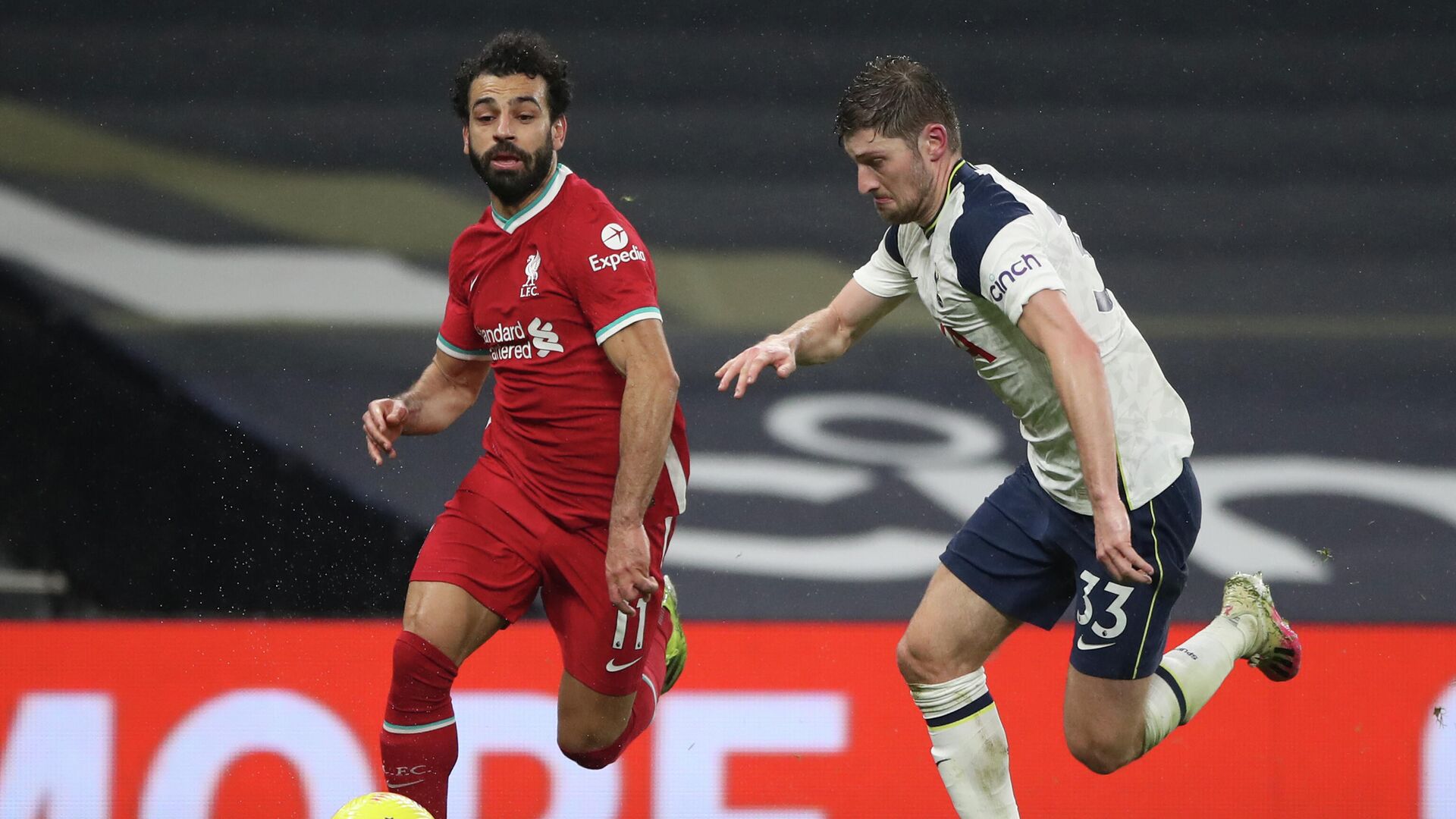 Liverpool's Egyptian midfielder Mohamed Salah (L) takes on Tottenham Hotspur's Welsh defender Ben Davies (R) during the English Premier League football match between Tottenham Hotspur and Liverpool at Tottenham Hotspur Stadium in London, on January 28, 2021. (Photo by Nick Potts / POOL / AFP) / RESTRICTED TO EDITORIAL USE. No use with unauthorized audio, video, data, fixture lists, club/league logos or 'live' services. Online in-match use limited to 120 images. An additional 40 images may be used in extra time. No video emulation. Social media in-match use limited to 120 images. An additional 40 images may be used in extra time. No use in betting publications, games or single club/league/player publications. /  - РИА Новости, 1920, 29.01.2021