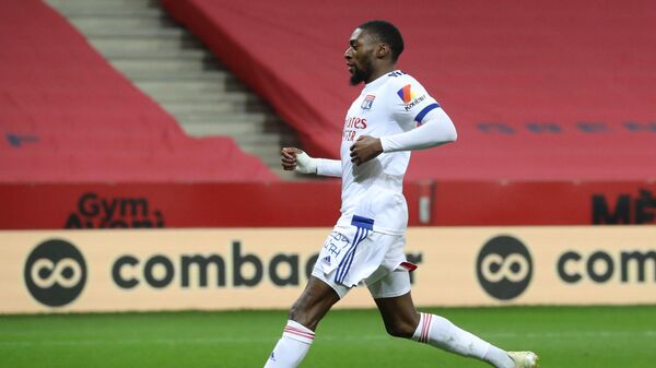 Lyon's Cameroonian forward Karl Toko Ekambi celebrates after scoring a goal during the French L1 football match between OGC Nice and Olympique Lyonnais at the Allianz Riviera stadium in Nice, on December 19, 2020. (Photo by Valery HACHE / AFP)